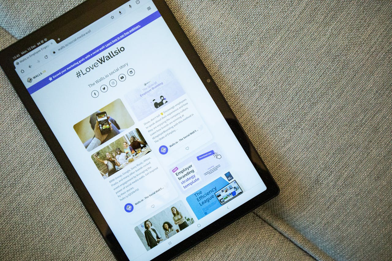 Home A tablet on a couch showing the Wallis.io website interface.